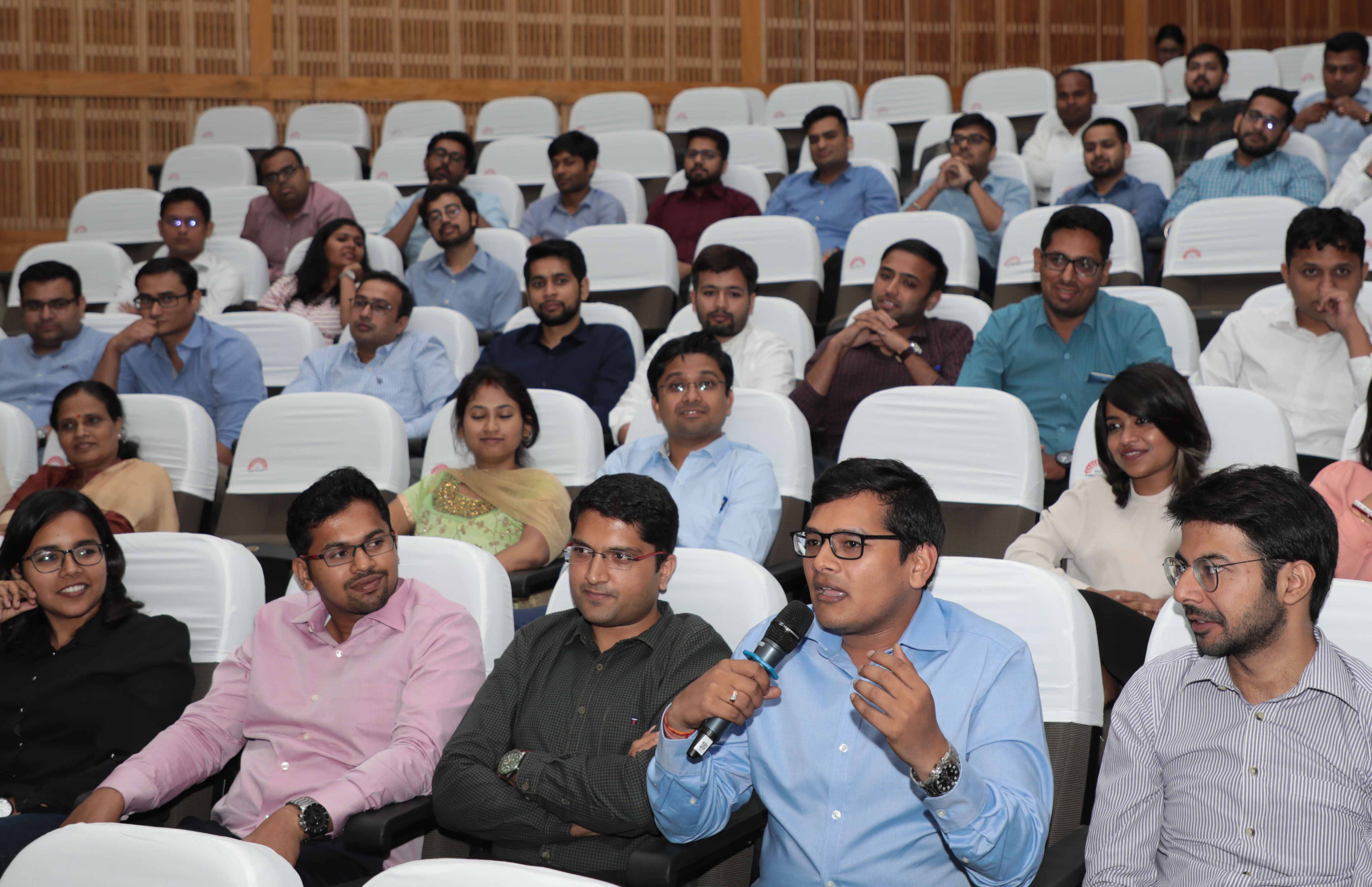 The incoming batch interacts with the Chief Guest after his address.